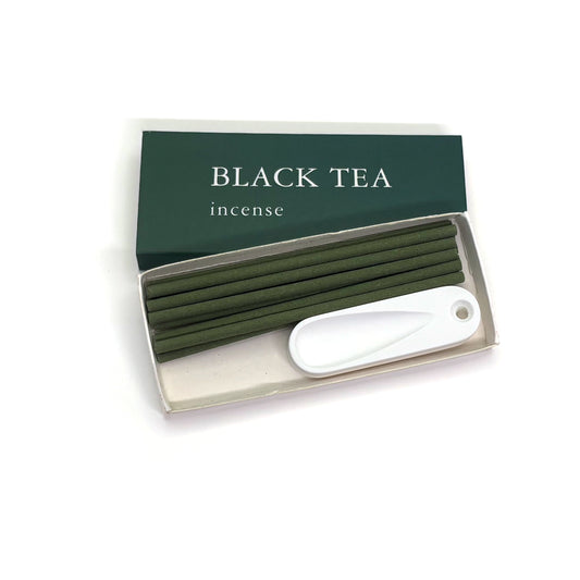 Black tea incense set with 10 green sticks and white plaster holder inside the box