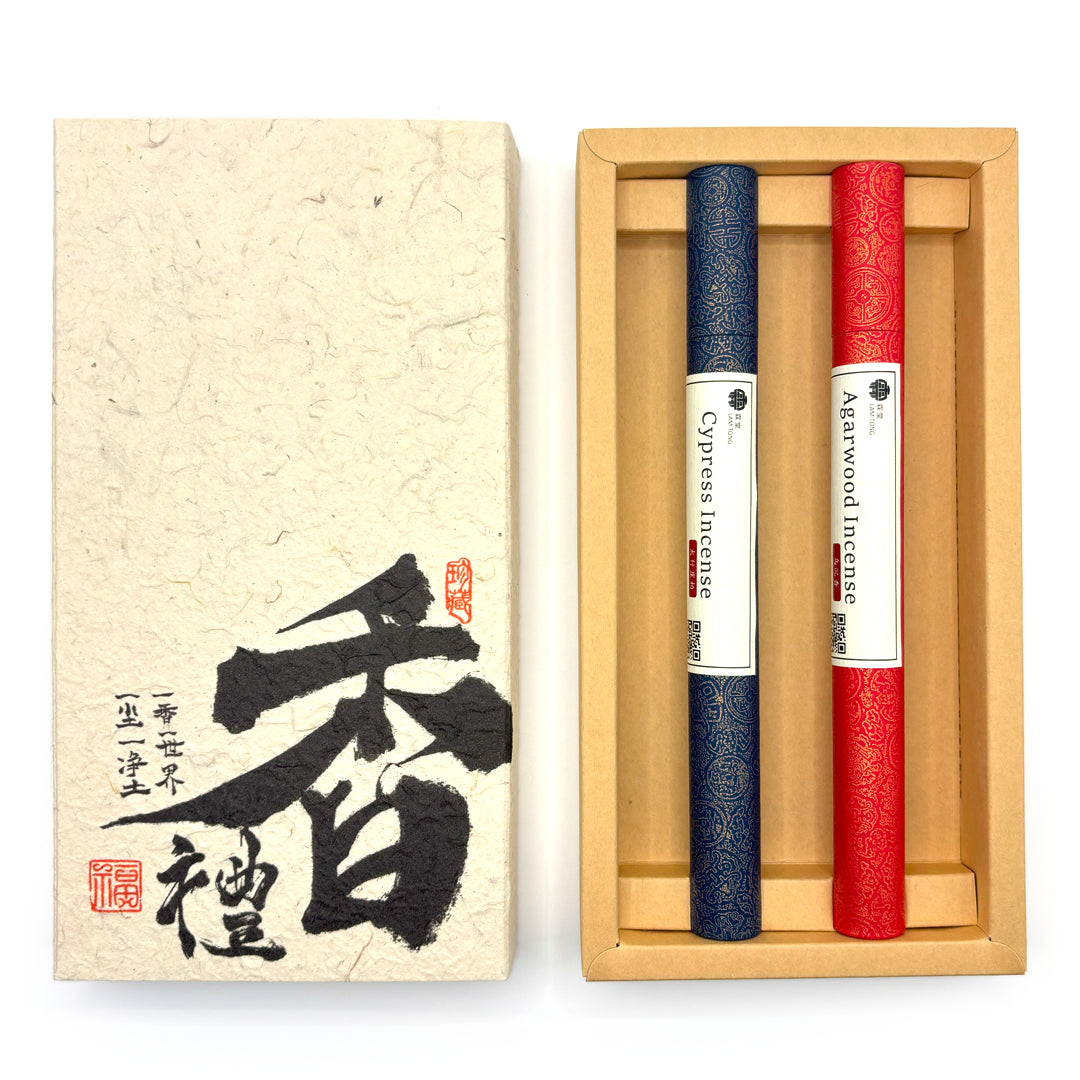 Dark Wood Ritual gift set opened to show Agarwood and Cypress incense in red and navy tubes
