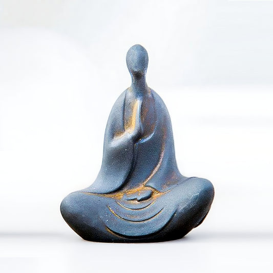 Front view of No-Face Zen Monk Statue in seated offering pose, iron and resin decor
