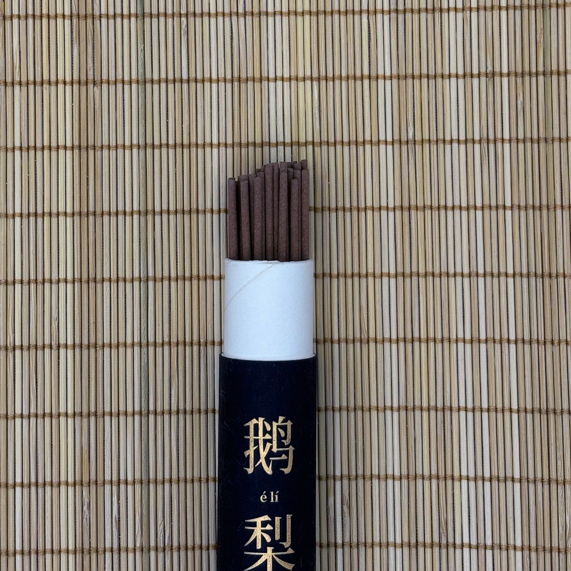 Open incense tube showing 45 sticks in elegant design