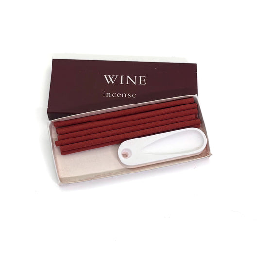 Open box of red wine incense with 10 sticks and white plaster holder