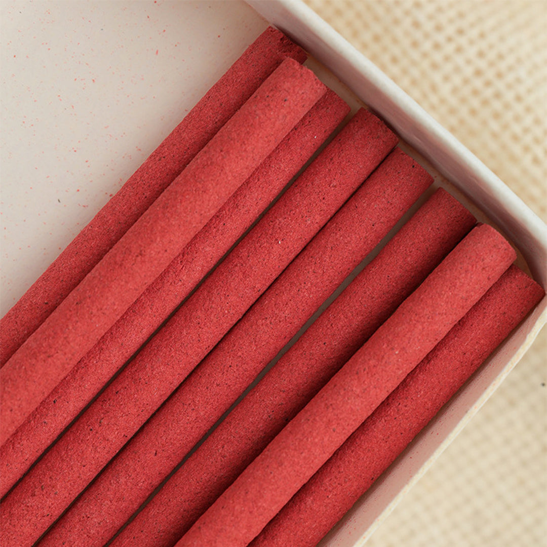 Close-up of red wine incense stick showing texture and thickness