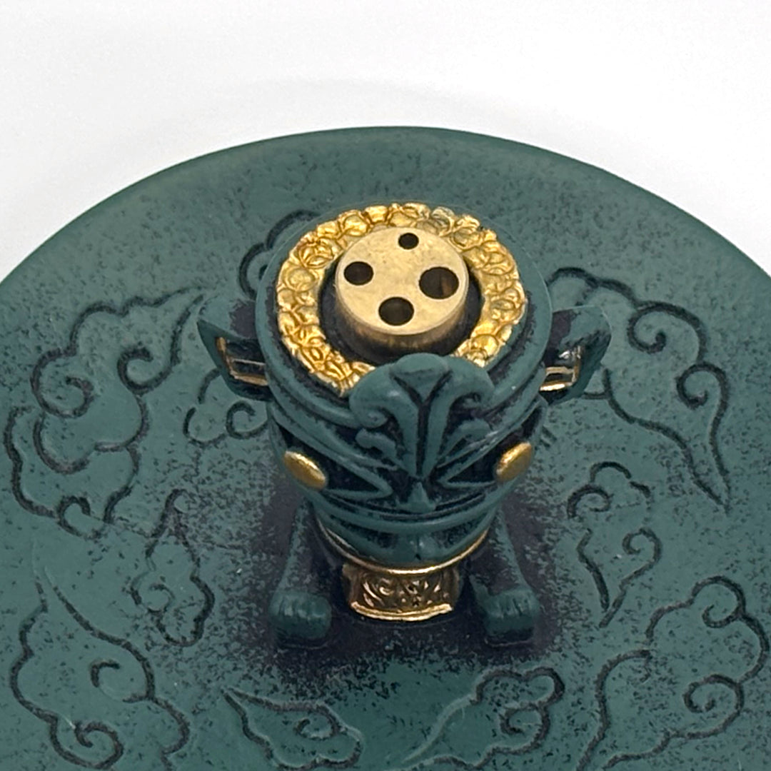 Top view of incense holder showing three incense holes and bronze detailing