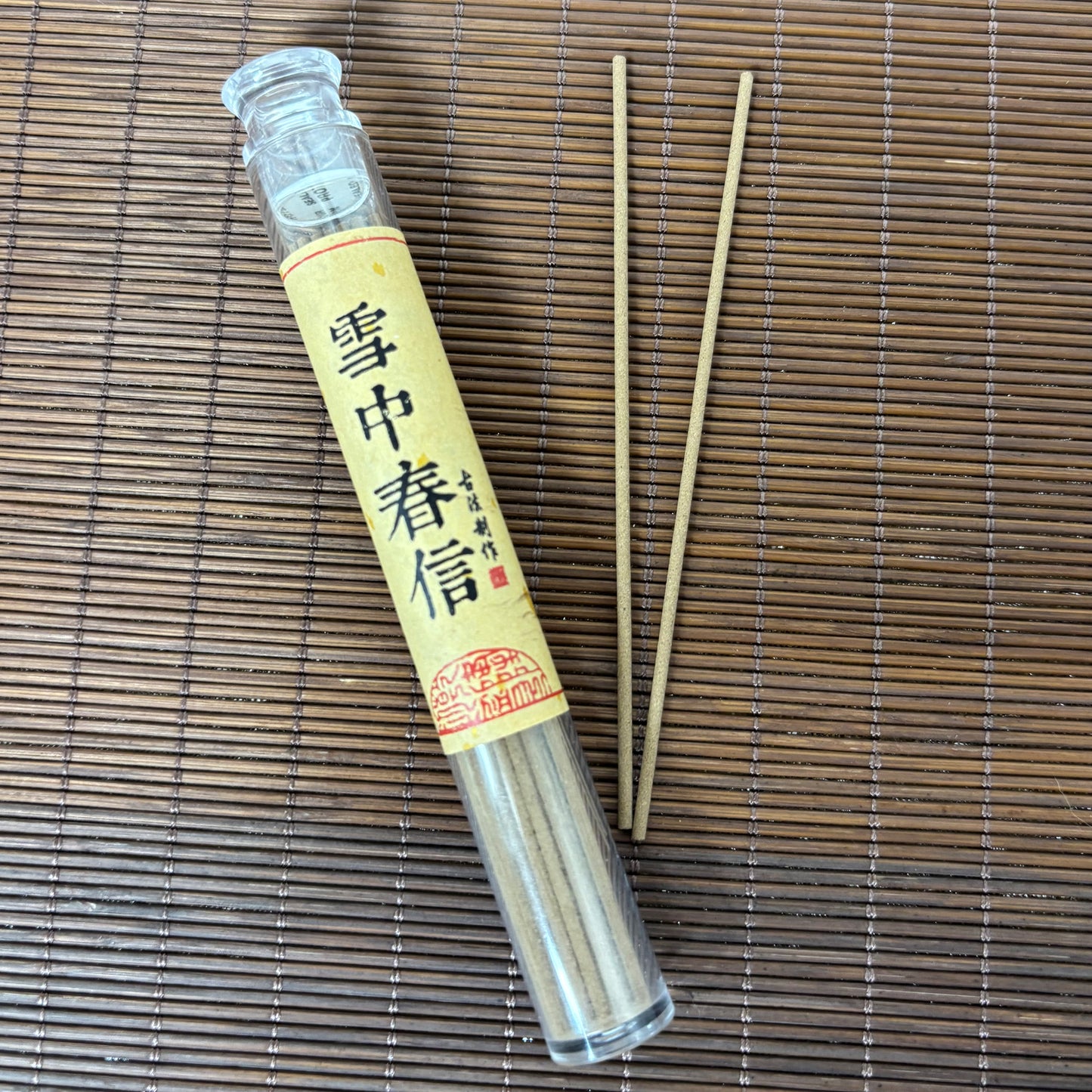 Spring in Snow incense in plastic tube with floral short sticks on bamboo mat