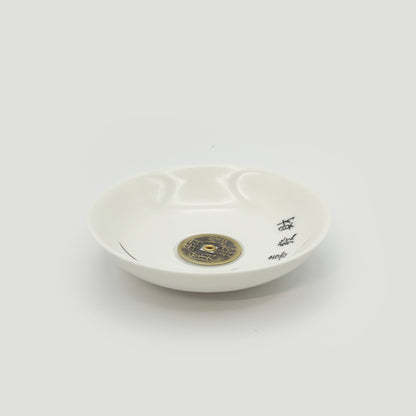 Side angle of the ceramic incense holder showing elegant curvature