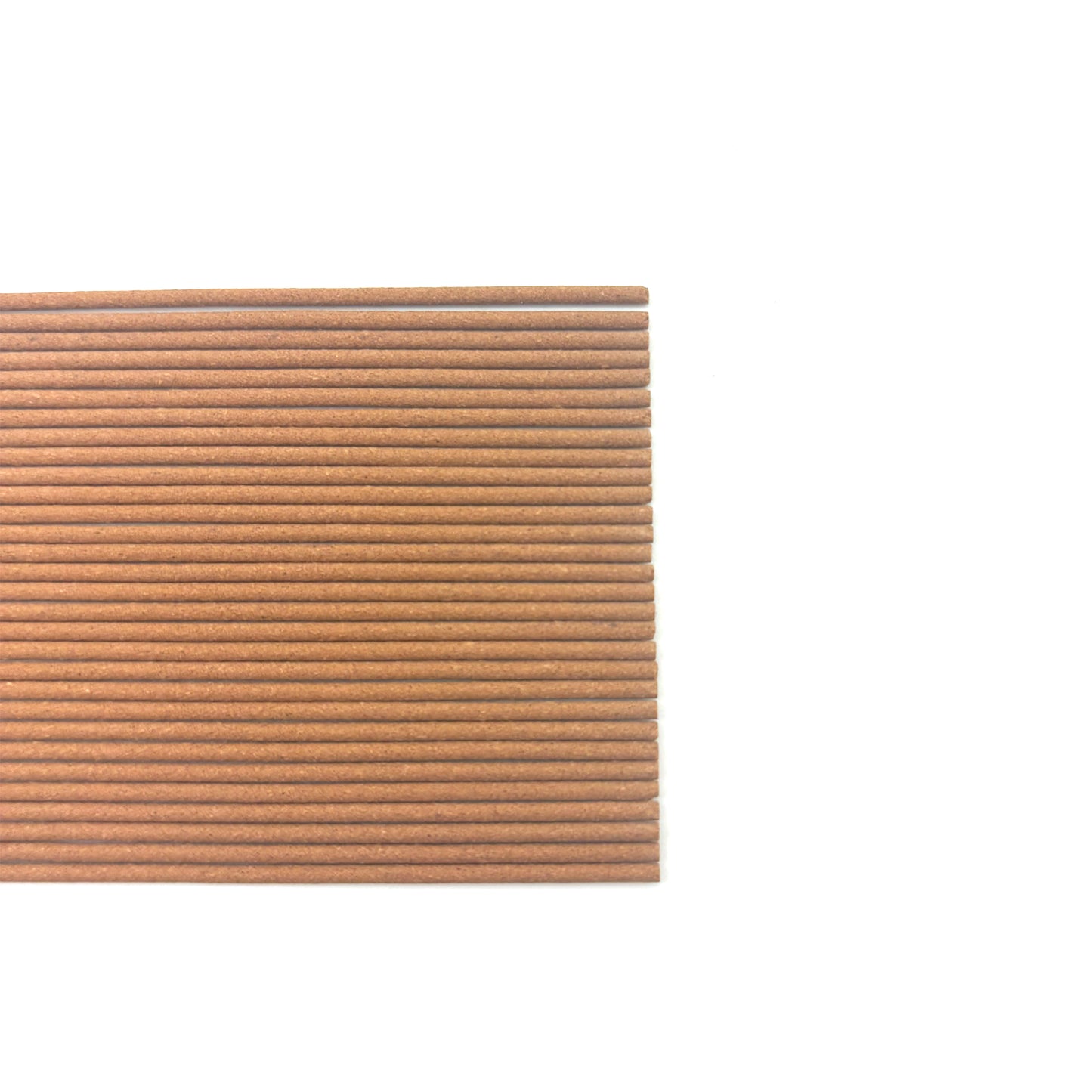 Flat lay view of White Tea incense sticks arranged neatly on a white background