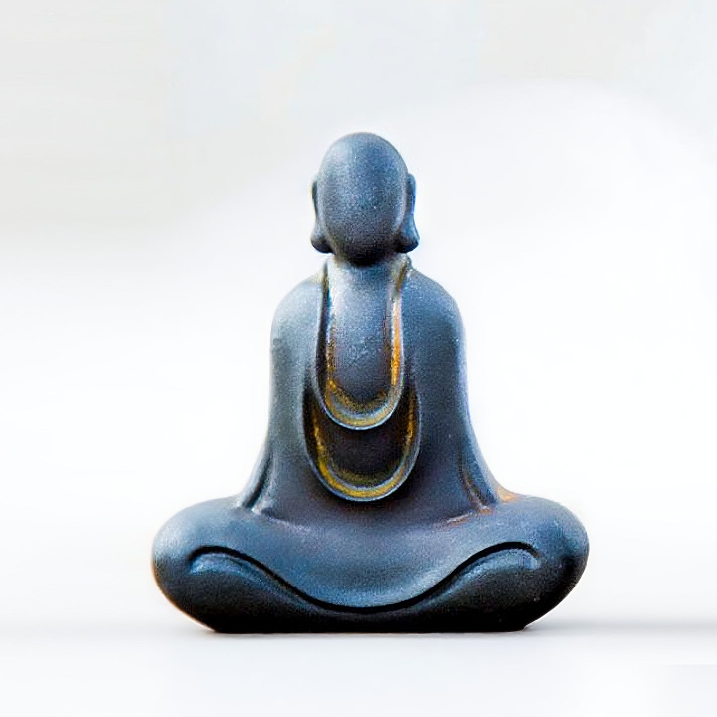 Front view of No-Face Zen Monk Statue in greeting pose, rustic zen decor ornament