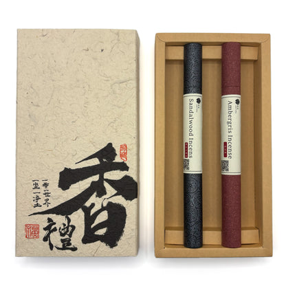 Wood & Ocean incense gift set opened to show Sandalwood and Ambergris tubes in red and navy packaging